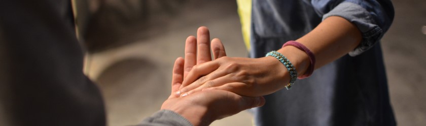Photo of hands clasping